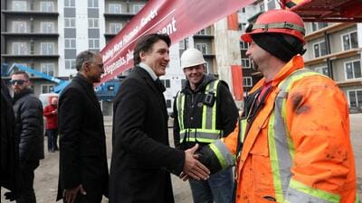 Prime Minister Justin Trudeau meets workers as he tours new construction at Edgemont Flats housing complex during an announcement of new funding for housing in Edmonton, Alberta, Canada, on February 21. (REUTERS) Prime Minister Justin Trudeau meets workers as he tours new construction at Edgemont Flats housing complex during an announcement of new funding for housing in Edmonton, Alberta, Canada, on February 21. (REUTERS)