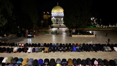 Muslim worshippers take part in the evening 'Tarawih' prayers during of the Muslim holy month of Ramadan, at Al-Aqsa compound (REUTERS)