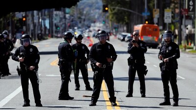 Law enforcement officers hold a line preventing demonstrators in support of Palestinians calling for a ceasefire in Gaza to access the area where the 96th Academy Awards Oscars ceremony is held, Sunday, March 10, 2024, in the Hollywood section of Los Angeles. (AP Photo/Etienne Laurent) (AP) Law enforcement officers hold a line preventing demonstrators in support of Palestinians calling for a ceasefire in Gaza to access the area where the 96th Academy Awards Oscars ceremony is held, Sunday, March 10, 2024, in the Hollywood section of Los Angeles. (AP Photo/Etienne Laurent) (AP)