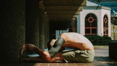5. Seated Forward Bend (Paschimottanasana): Forward bends can help stimulate the bladder and kidneys while stretching the back and hamstrings. Sit on the floor with your legs extended in front of you. Inhale to lengthen your spine, then exhale as you hinge forward from your hips, reaching toward your feet. Keep your back flat and avoid rounding your spine. Hold for a few breaths, then release. (Photo by Benn McGuinness on Unsplash) 5. Seated Forward Bend (Paschimottanasana): Forward bends can help stimulate the bladder and kidneys while stretching the back and hamstrings. Sit on the floor with your legs extended in front of you. Inhale to lengthen your spine, then exhale as you hinge forward from your hips, reaching toward your feet. Keep your back flat and avoid rounding your spine. Hold for a few breaths, then release. (Photo by Benn McGuinness on Unsplash)