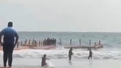 Several were injured in Kerala as a wave overturned a floating bridge at Varkala Beach. (PTI) Several were injured in Kerala as a wave overturned a floating bridge at Varkala Beach. (PTI)