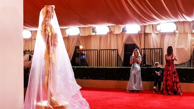 An Oscar statue is covered in plastic as preparations continue for the 96th Academy Awards. (REUTERS)