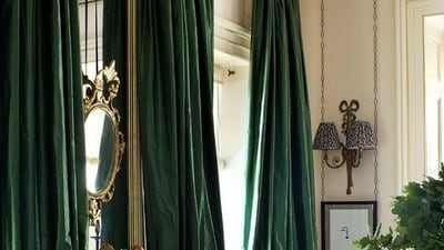 Fabric Drapes and Throws: Use rich fabrics like velvet or silk in deep jewel tones to drape over furniture or hang as curtains, creating a cozy and luxurious ambiance.&nbsp; (Pinterest)