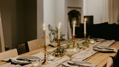 Ramadan-themed Table Settings: Set your dining table with themed placemats, napkin rings, and candles in warm hues to elevate the dining experience during Suhoor and Iftar. (Unsplash)