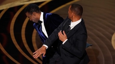 Will Smith, right, hits presenter Chris Rock on stage at the Oscars. (AP) (Chris Pizzello/Invision/AP) Will Smith, right, hits presenter Chris Rock on stage at the Oscars. (AP) (Chris Pizzello/Invision/AP)