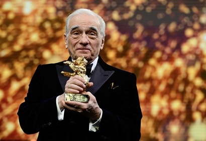 Martin Scorsese cheers with the Honorary Golden Bear Award during the Hommage Gala Award Ceremony at the 74th Berlinale film festival. (AFP) Martin Scorsese cheers with the Honorary Golden Bear Award during the Hommage Gala Award Ceremony at the 74th Berlinale film festival. (AFP)