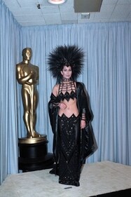 Cher looked like a gothic queen in an all black shimmer ensemble (Getty images ) Cher looked like a gothic queen in an all black shimmer ensemble (Getty images )