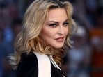 Madonna scolded a fan for sitting down during a concert only to notice a wheelchair (REUTERS/Neil Hall/File Photo)