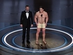 Oscars 2024: John Cena (right) on stage with host Jimmy Kimmel (left) during the presentation of the award for Best Costume Design at the 96th Academy Awards in Hollywood, California. 