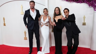 Chris Hemsworth, Elsa Pataky, Susan Downey, and Robert Downey Jr pose together on the Oscars 2024 red carpet. Robert, who won the Best Supporting Actor Award for Oppenheimer, and Chris chose black tailored suits for the awards night. While Chris styled his blazer-pant set with a white button-down, Robert chose a black shirt, (Jordan Strauss/Invision/AP) Chris Hemsworth, Elsa Pataky, Susan Downey, and Robert Downey Jr pose together on the Oscars 2024 red carpet. Robert, who won the Best Supporting Actor Award for Oppenheimer, and Chris chose black tailored suits for the awards night. While Chris styled his blazer-pant set with a white button-down, Robert chose a black shirt, (Jordan Strauss/Invision/AP)