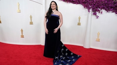 Lily Gladstone, nominated as Best Actress for her turn in "Killers of the Flower Moon,” paid tribute to Native American design with a blue velvet Gucci gown created in collaboration with Indigenous artist Joe Big Mountain. (Jordan Strauss/Invision/AP) Lily Gladstone, nominated as Best Actress for her turn in "Killers of the Flower Moon,” paid tribute to Native American design with a blue velvet Gucci gown created in collaboration with Indigenous artist Joe Big Mountain. (Jordan Strauss/Invision/AP)
