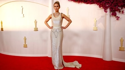 Emily Blunt's Oscars look is all about shimmer and sequins as she dazzled on the red carpet in a Champagne Schiaparelli gown. From the shimmering fabric to the bodycon fit and glam accessories, everything about her look is glamorous. (REUTERS)