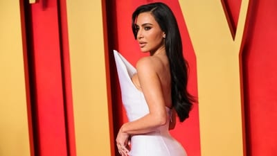 Kim Kardashian arrived at the after-party in a custom Balenciaga gown featuring a pointed neckline, corseted bodice, a form-fitted skirt, and a train at the back. Statement sunglasses, striking eye makeup and side-parted loose locks rounded it all off.&nbsp; (REUTERS)