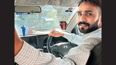 Cab driver Rajneesh describes himself as a simple person. (HT Photo) Cab driver Rajneesh describes himself as a simple person. (HT Photo)