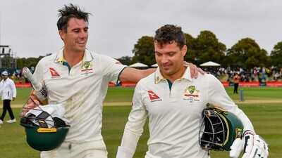 Australia's Alex Carey, right, and Pat Cummins walk from the field after defeating New Zealand . (AP) Australia's Alex Carey, right, and Pat Cummins walk from the field after defeating New Zealand . (AP)