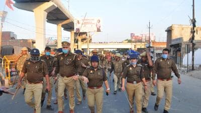 Police personnel patrolling the area after stone-pelting in Akbar Nagar, in Lucknow on Sunday. (HT PHOTO)
