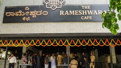 Security personnel stand guard at the Rameshwaram cafe blast site, in Bengaluru. (PTI) Security personnel stand guard at the Rameshwaram cafe blast site, in Bengaluru. (PTI)