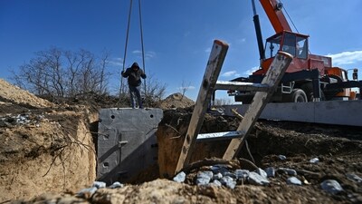 Workers built a concrete dugout as part of a system of new fortifications, amid Russia's attack on Ukraine, in Zaporizhzhia region. (REUTERS)