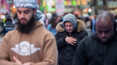 More than 100 faithful gathered for the prayer meeting despite cold, windy conditions. (AFP)