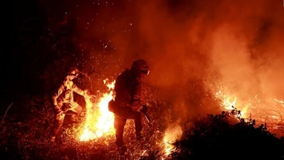 Firefighters tackle a blaze near the village of Piedrafita in northern Spain's Asturias region. (Reuters) Firefighters tackle a blaze near the village of Piedrafita in northern Spain's Asturias region. (Reuters)