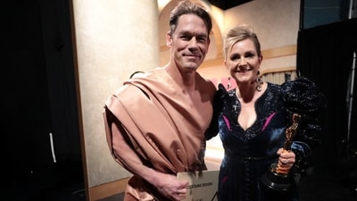 Holly Waddington and John Cena during the Oscars show. The designer and the actor clicked some pictures backstage together.&nbsp; (via REUTERS)