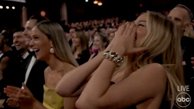 Margot Robbie also broke into a laugh at Cena's naked appearance on stage. 