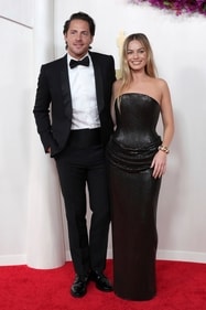 Tom Ackerley, left, and Margot Robbie arrive at the Oscars on Sunday, March 10, 2024, at the Dolby Theatre in Los Angeles. (Jordan Strauss/Invision/AP) Tom Ackerley, left, and Margot Robbie arrive at the Oscars on Sunday, March 10, 2024, at the Dolby Theatre in Los Angeles. (Jordan Strauss/Invision/AP)