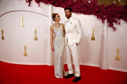 Emily Blunt and John Krasinski pose on the red carpet during the Oscars arrivals at the 96th Academy Awards in Hollywood, Los Angeles, California, U.S. (REUTERS)