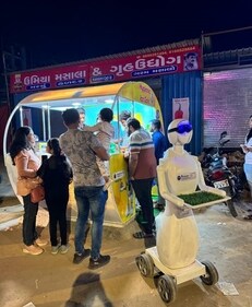 Dishing up cool: Aisha the robot at the food truck (Robotic Cafe ) Dishing up cool: Aisha the robot at the food truck (Robotic Cafe )