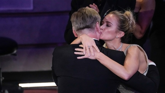 Emily Blunt gives her Oppenheimer Christopher Nolan director a kiss. Emily was nominted in Best Supporting Actress category but lost to Da'Vine Joy Randolph. Nolan won the Best Director trophy.