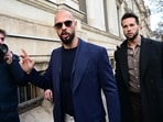Andrew Tate (L) and Tristan Tate (R) have been arrested in Romania over UK sex offence charges, police said on March 12, 2024.