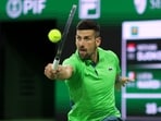 Novak Djokovic of Serbia plays a backhand against Luca Nardi of Italy Novak Djokovic of Serbia plays a backhand against Luca Nardi of Italy