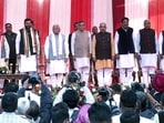 Newly sworn-in Haryana Chief Minister Nayab Singh Saini with his cabinet, governor Bandaru Dattatreya and former Haryana CM Manohar Lal Khattar at the Raj Bhavan in Chandigarh on Tuesday. (ANI) Newly sworn-in Haryana Chief Minister Nayab Singh Saini with his cabinet, governor Bandaru Dattatreya and former Haryana CM Manohar Lal Khattar at the Raj Bhavan in Chandigarh on Tuesday. (ANI)