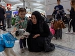 Passengers pet one of five therapy dogs as they roam Istanbul Airport, searching for stressed passengers who are looking to calm their nerves before they board their flight.