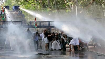 A water canon being used on Youth Congress supporters during the protest against the implementation of CAA, at Kerala Raj Bhavan, in Thiruvananthapuram on Tuesday. (ANI)
