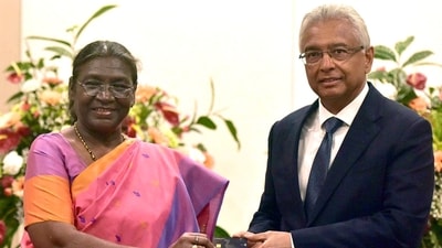 President Droupadi Murmu presents a RuPay card to Mauritius Prime Minister Pravind Kumar Jugnauth during her three-day visit to Mauritius on Monday. (X/@MEAIndia) President Droupadi Murmu presents a RuPay card to Mauritius Prime Minister Pravind Kumar Jugnauth during her three-day visit to Mauritius on Monday. (X/@MEAIndia)