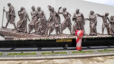 President Droupadi Murmu poses for a picture in front of the statue depicting Mahatma Gandhi's Dandi March Satyagrah as she reaches the Mahatma Gandhi Metro Station through a metro ride on Tuesday. (X/@MEAIndia) President Droupadi Murmu poses for a picture in front of the statue depicting Mahatma Gandhi's Dandi March Satyagrah as she reaches the Mahatma Gandhi Metro Station through a metro ride on Tuesday. (X/@MEAIndia)