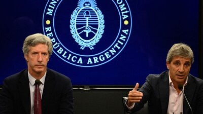 Argentina Economy Minister Luis Caputo (R), accompanied by the President of the Central Bank of Argentina Santiago Bausili (L), speaks during a press conference. (AFP) Argentina Economy Minister Luis Caputo (R), accompanied by the President of the Central Bank of Argentina Santiago Bausili (L), speaks during a press conference. (AFP)