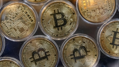 Bitcoin prices: Physical imitations of bitcoins are pictured at a cryptocurrency exchange branch. (AFP) Bitcoin prices: Physical imitations of bitcoins are pictured at a cryptocurrency exchange branch. (AFP)