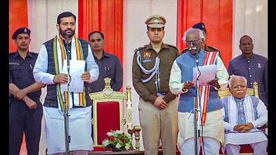 Haryana Governor Bandaru Dattatraya administers the oath to BJP leader Nayab Singh Saini as chief minister of Haryana, on Tuesday. (PTI) Haryana Governor Bandaru Dattatraya administers the oath to BJP leader Nayab Singh Saini as chief minister of Haryana, on Tuesday. (PTI)