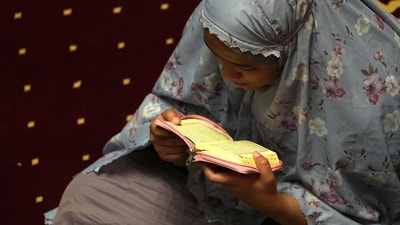 A worshiper observes the first Taraweeh prayers of Ramadan at the Istiqlal Mosque in Jakarta, Indonesia on Monday. (Bloomberg) A worshiper observes the first Taraweeh prayers of Ramadan at the Istiqlal Mosque in Jakarta, Indonesia on Monday. (Bloomberg)