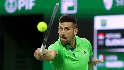 Novak Djokovic of Serbia plays a backhand against Luca Nardi of Italy (Getty Images via AFP) Novak Djokovic of Serbia plays a backhand against Luca Nardi of Italy (Getty Images via AFP)