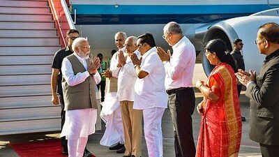 PM Narendra Modi was received by Gujarat Governor Acharya Devvrat and Chief Minister Bhupendra Patel on his arrival for the 'Ashram Bhoomi Vandana' programme in Ahmedabad. (PTI) PM Narendra Modi was received by Gujarat Governor Acharya Devvrat and Chief Minister Bhupendra Patel on his arrival for the 'Ashram Bhoomi Vandana' programme in Ahmedabad. (PTI)
