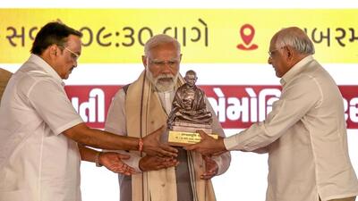Prime Minister Narendra Modi being felicitated by Gujarat chief minister Bhupendra Patel at Sabarmati Ashram in Ahmedabad on Tuesday. (PTI) Prime Minister Narendra Modi being felicitated by Gujarat chief minister Bhupendra Patel at Sabarmati Ashram in Ahmedabad on Tuesday. (PTI)