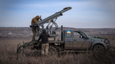 Ukrainian soldiers from The 56th Separate Motorized Infantry Mariupol Brigade prepare to fire a multiple launch rocket system (AP) Ukrainian soldiers from The 56th Separate Motorized Infantry Mariupol Brigade prepare to fire a multiple launch rocket system (AP)