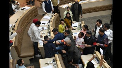 Several BJP councillors were marshaled out after being suspended by the AAP mayor during the MC House meeting in Chandigarh on Monday. (Keshav Singh/HT) Several BJP councillors were marshaled out after being suspended by the AAP mayor during the MC House meeting in Chandigarh on Monday. (Keshav Singh/HT)
