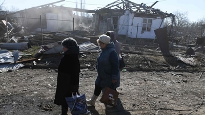 Local residents clear rubble of ruined houses following shelling on the settlement of Hanzhenkova on the outskirts of Makiivka (AFP) Local residents clear rubble of ruined houses following shelling on the settlement of Hanzhenkova on the outskirts of Makiivka (AFP)