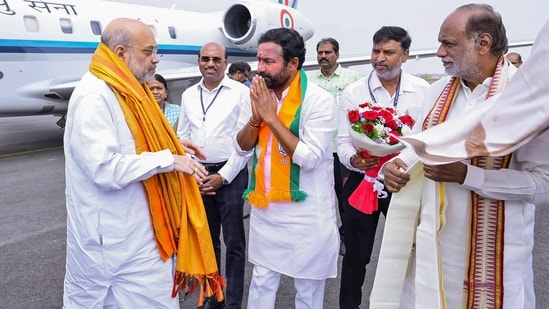 Hyderabad: Amit Shah being received by union minister G Kishan Reddy upon his arrival in Hyderabad, Tuesday. (PTI)