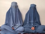 Two burqa-clad sisters are protesting against the Taliban with their music. Two burqa-clad sisters are protesting against the Taliban with their music.