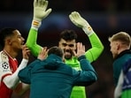 Arsenal's David Raya celebrates after saving from FC Porto's Galeno to win the penalty shoot-out